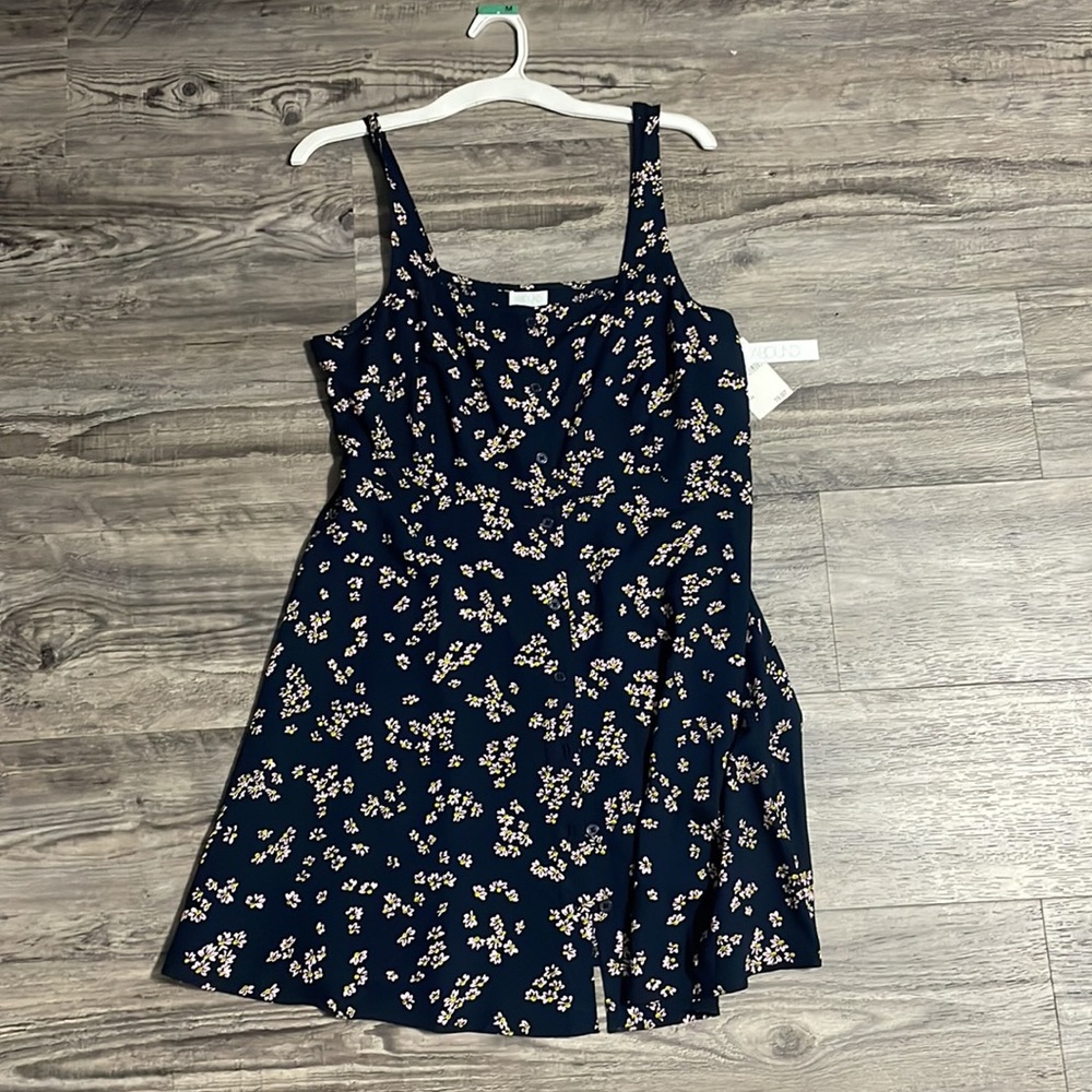 Navy flowered dress. Buttons good g down the dress. Medium length